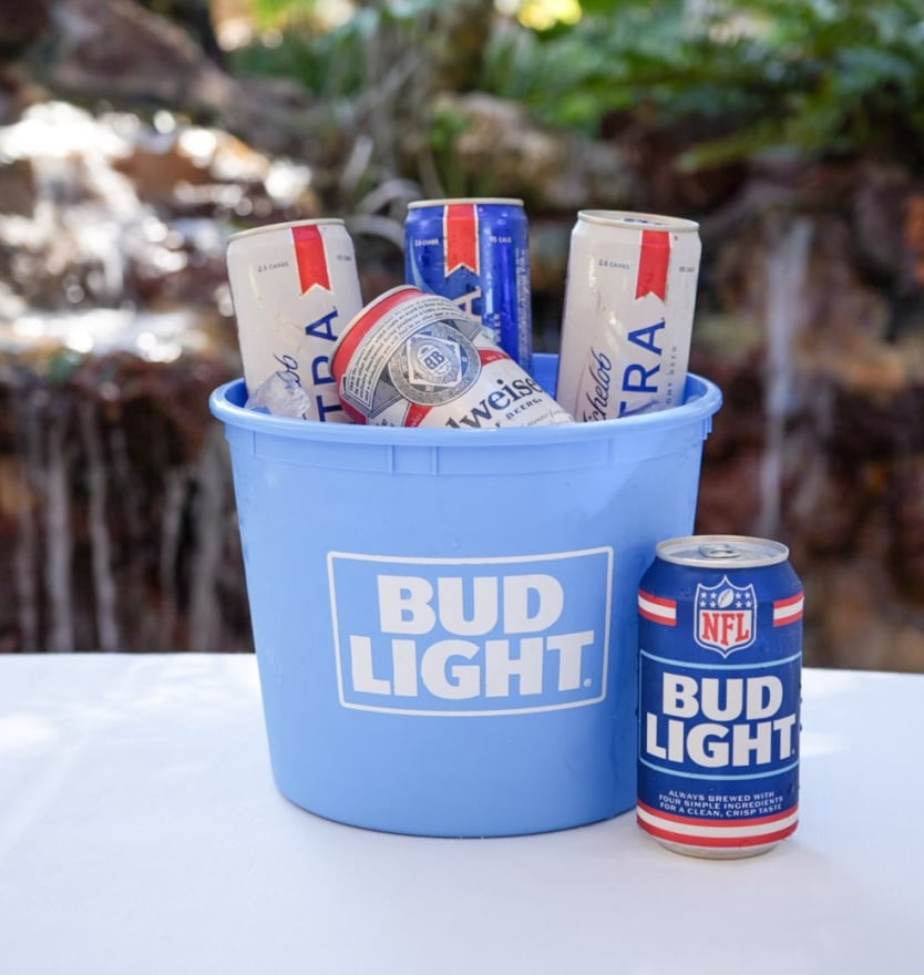 A blue ice bucket branded with 